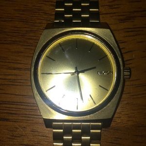 Men’s gold Nixon watch